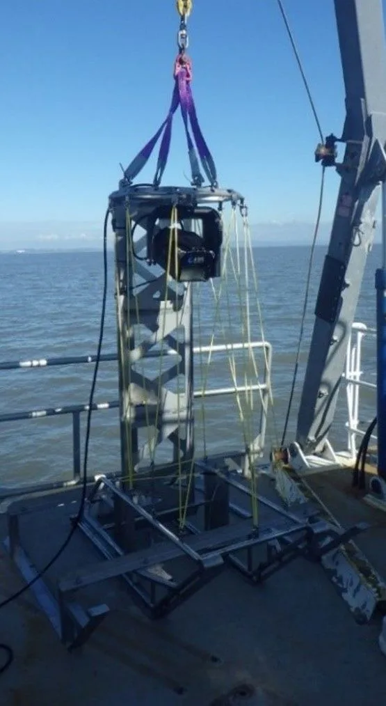 Picture of an ARIS camera ready to be deployed off the side of a boat into the sea